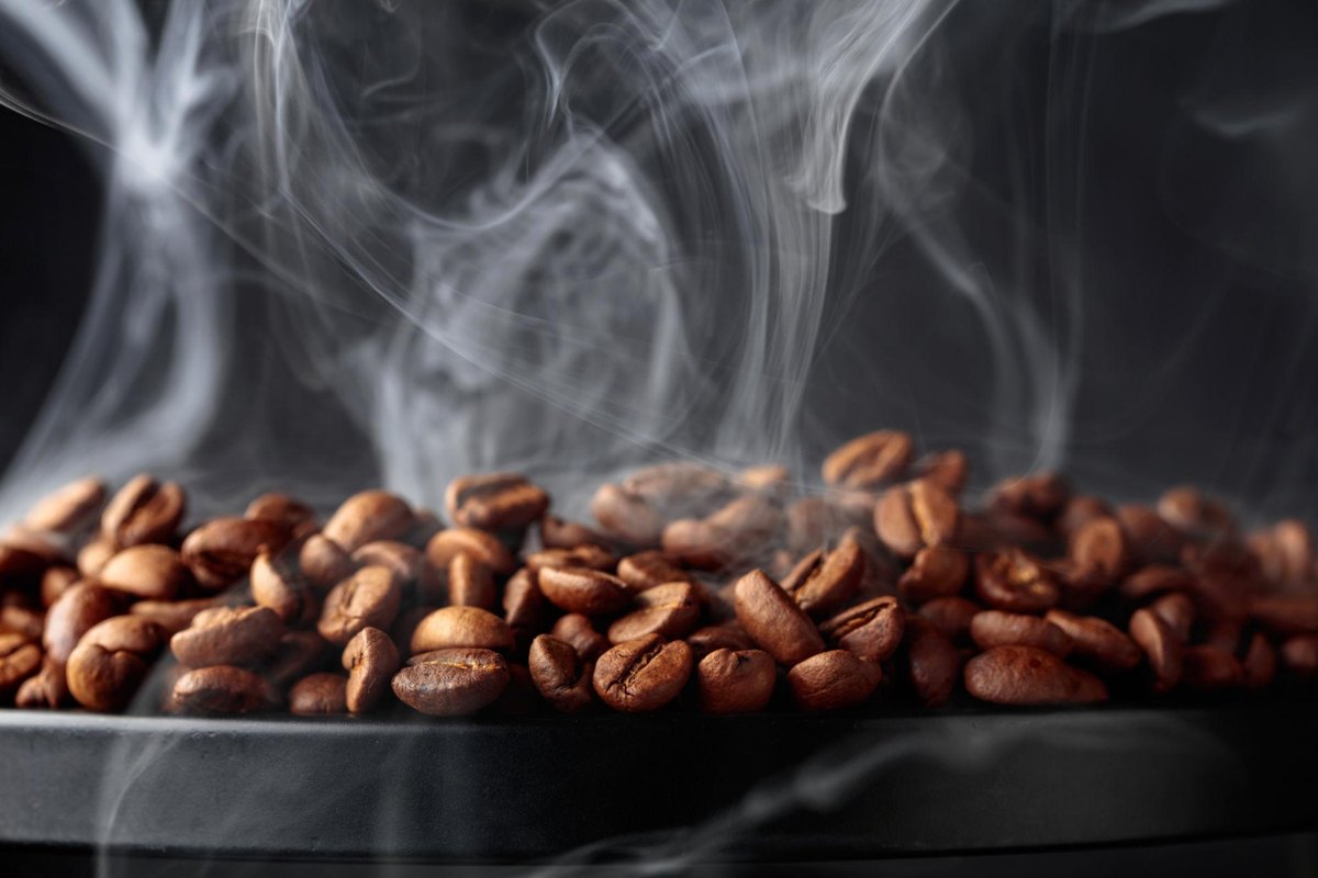 Fresh roasted coffee beans with steam